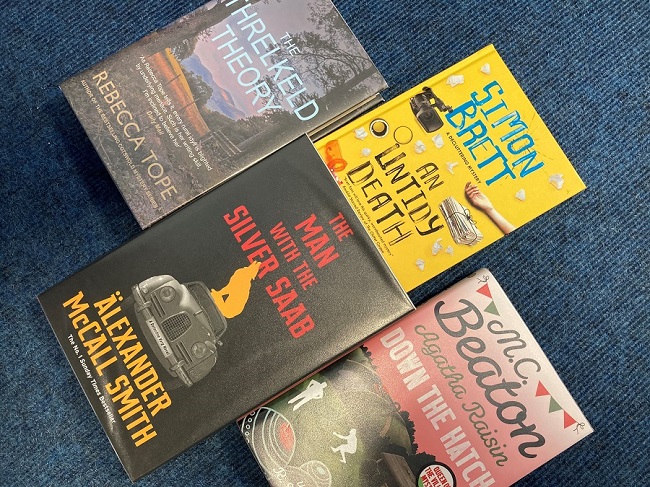four Cozy Crime books