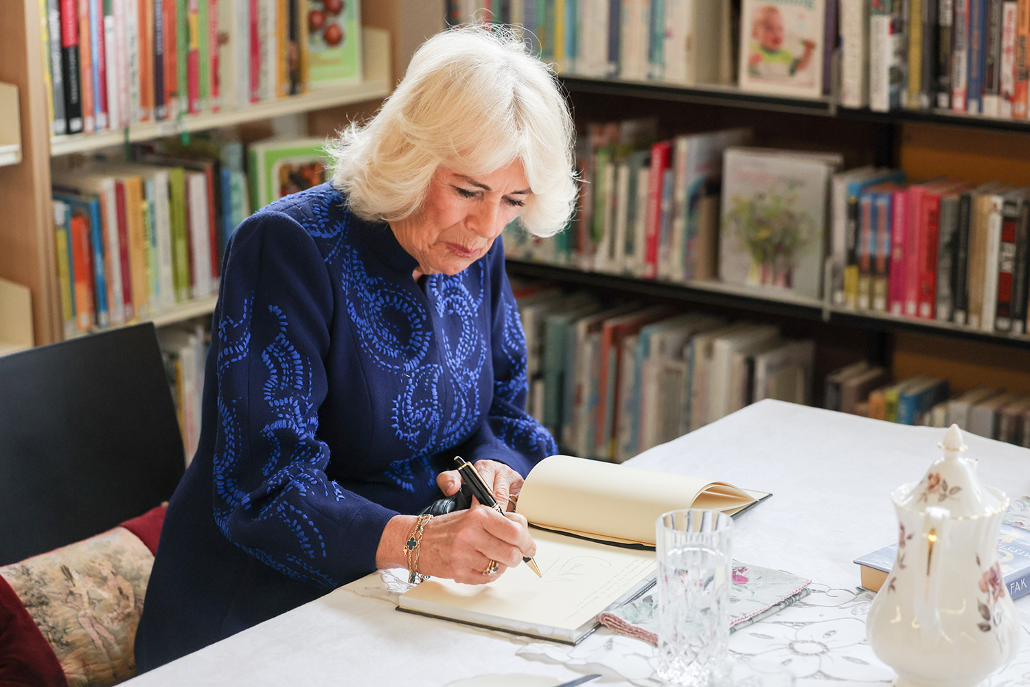 Her Majesty The Queen signs the Libraries NI Visitors Book during her visit to Banbridge Library
