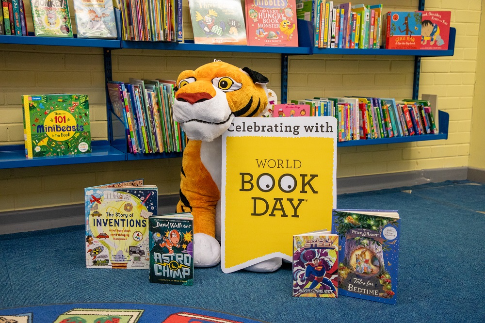 A toy tiger with some books to celebrate World Book Day 2025
