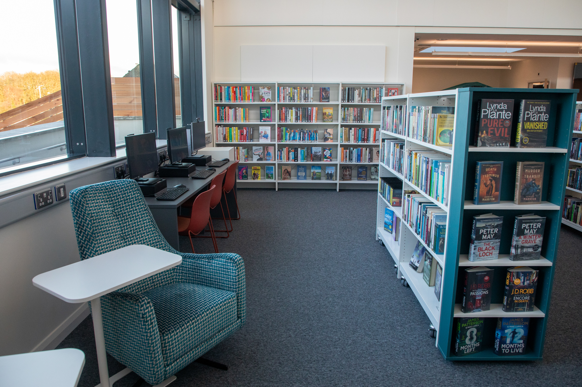 Fivemiletown Library Interior Reading Area With Bookshelves Seating And Computers