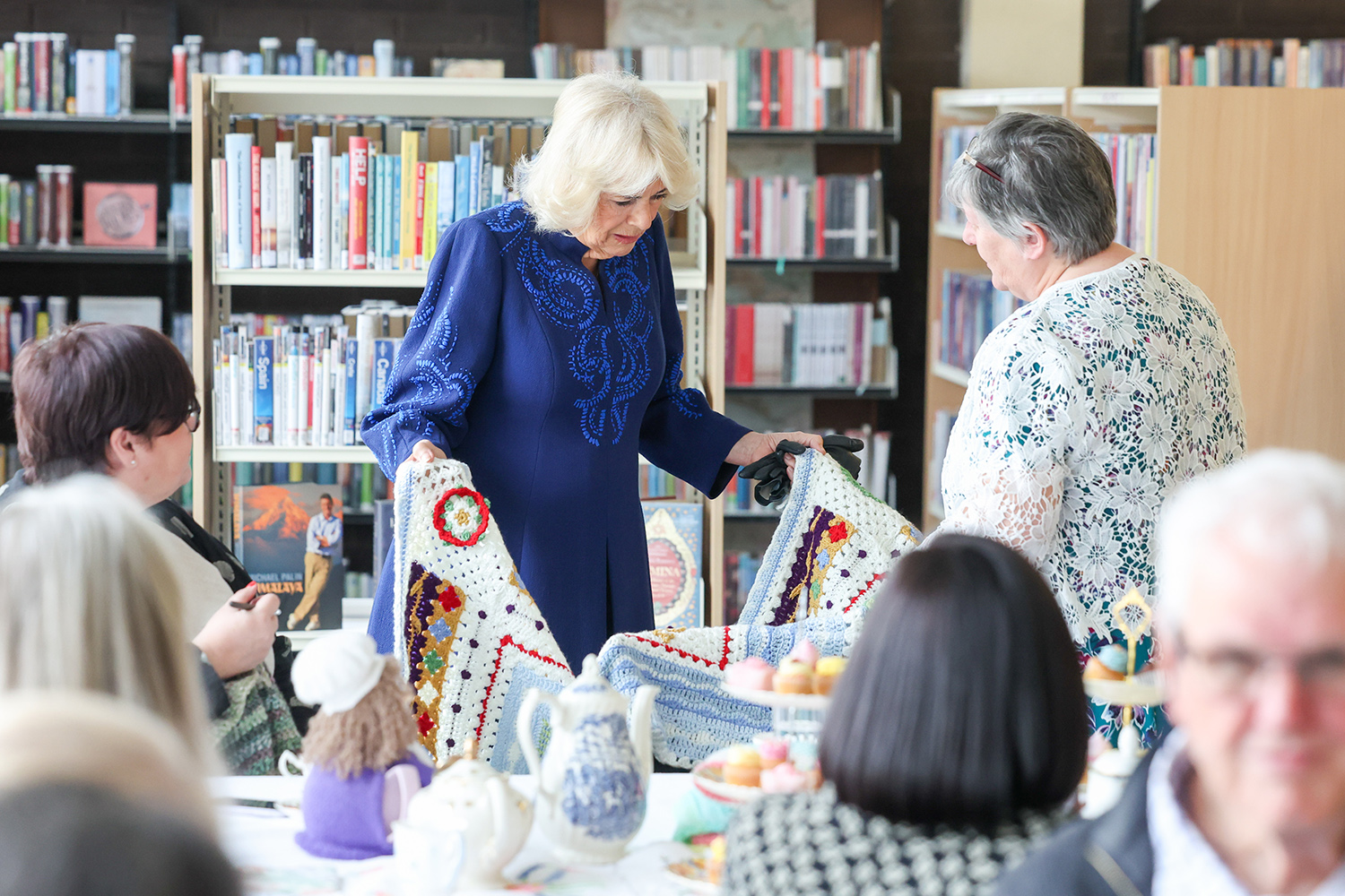 Her Majesty The Queen chats with members of Banbridge Library’s Craft and Chatter group, admiring their latest projects and hearing how the library provides a welcoming space for creativity and connection.
