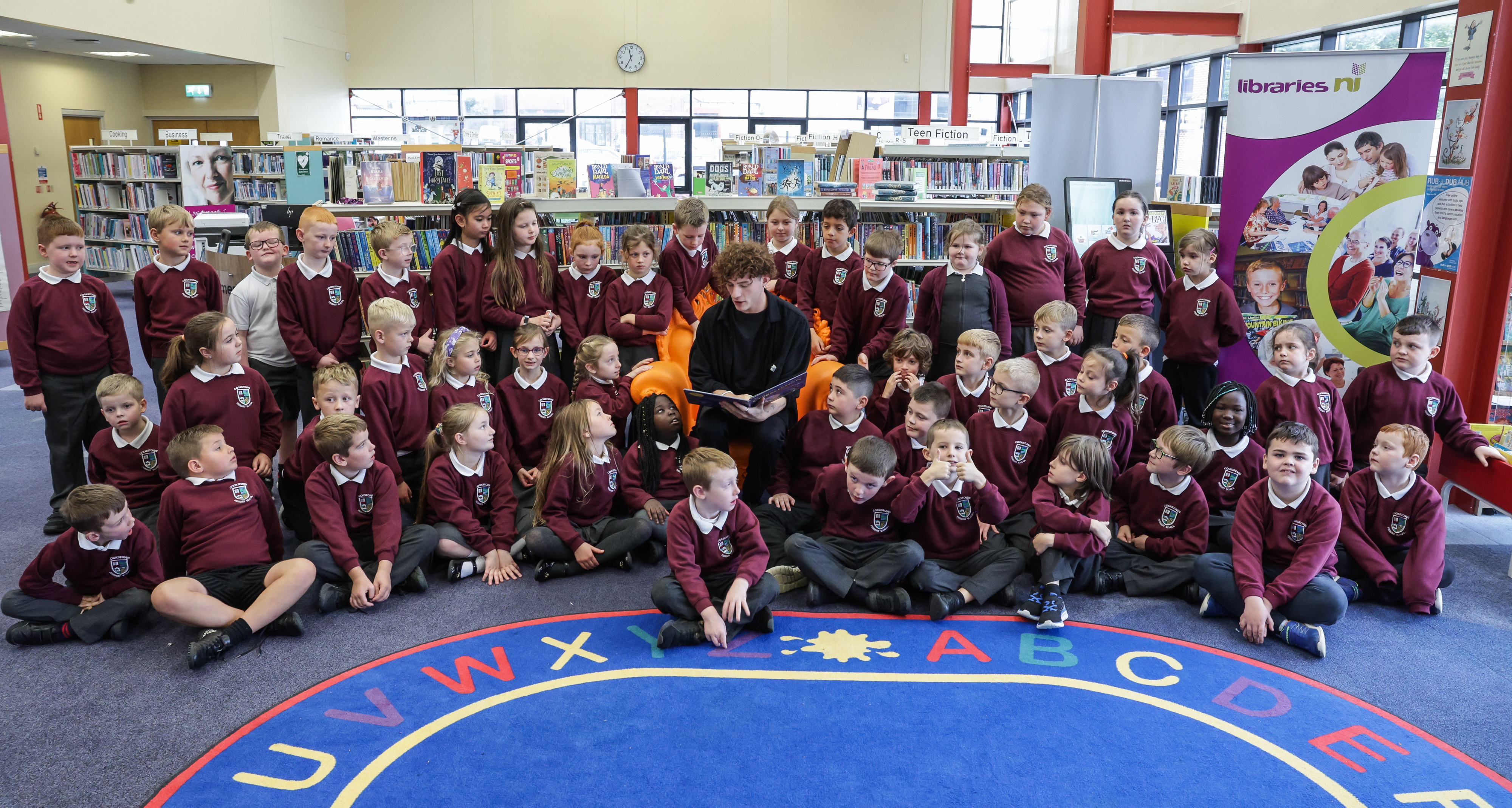 Blue Peter presenter Joel M is pictured with primary four children from Cookstown Primary School