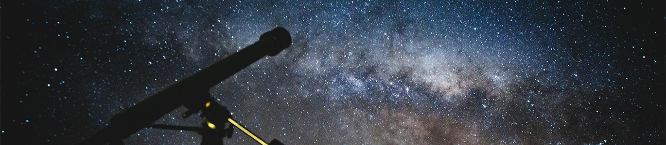A telescope pointed to the sky at night