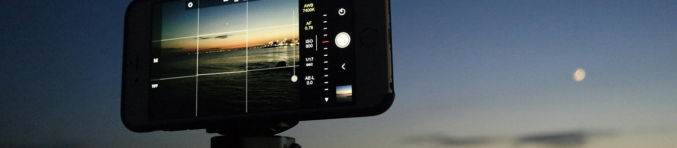 A mobile phone set up to take an outdoor photograph