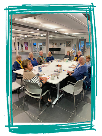 Reading group sitting around a table