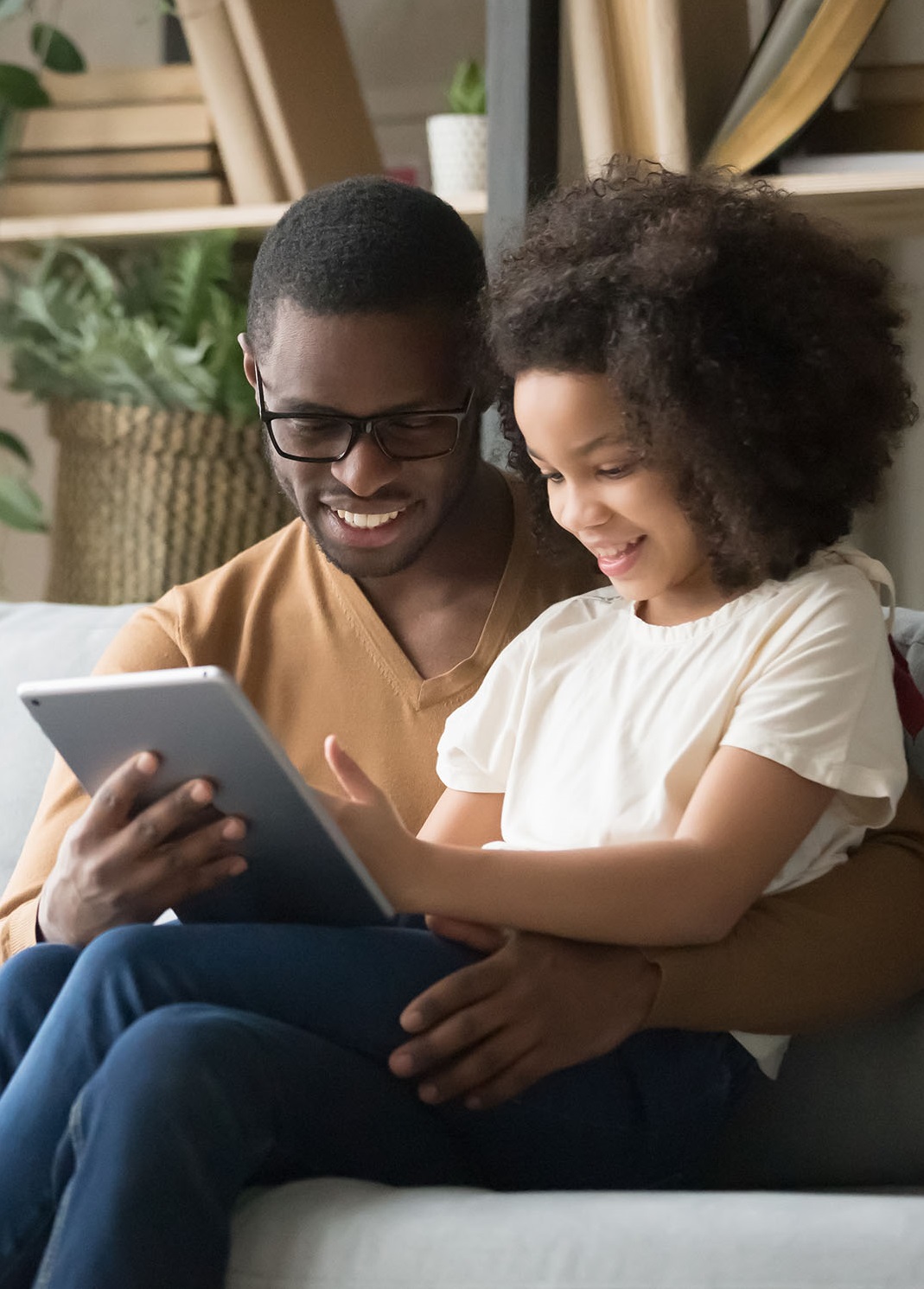 Dad Reading With Child At Bedtime
