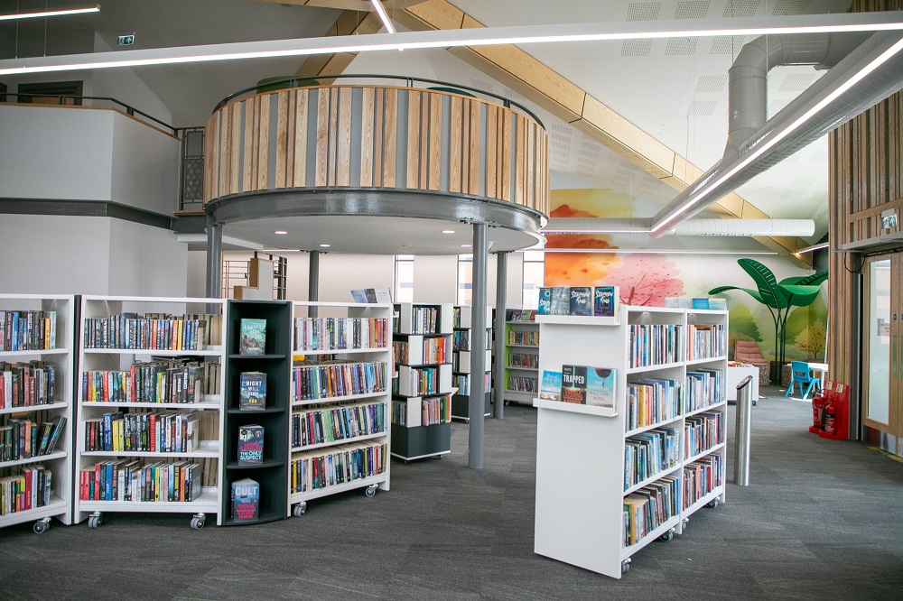 Ballymoney Library's beautiful new interior with book shelves full of books