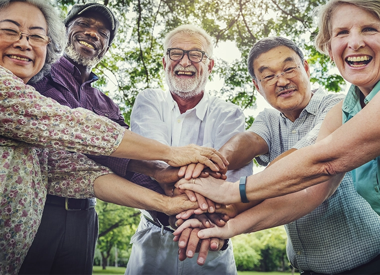 Highlight tile showing a photo of a group of senior citizens