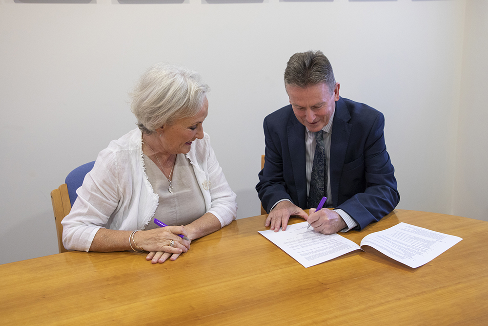Libraries NI Chief Executive Jim O’Hagan and Commissioner for Older People for Northern Ireland Siobhan Casey sign a new three-year Memorandum of Understanding at Lisburn City Library, strengthening the partnership between the two organisations to support older people across Northern Ireland.