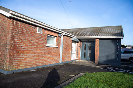 Photo of Ballycastle Library's exterior showing its front entrance
