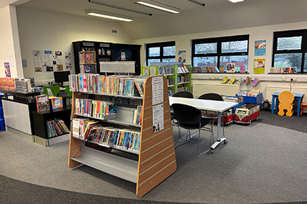 photo of Carryduff Library Interior showing bookcase and children's reading area